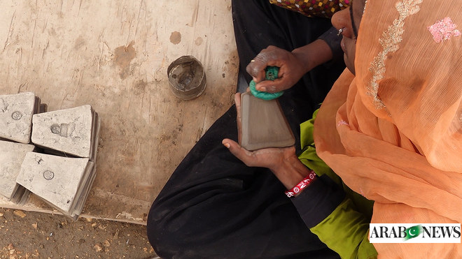 Former beggar women in Pakistan’s Sindh province make a new life through tile making